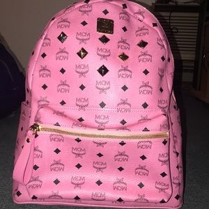 dark pink mcm backpack